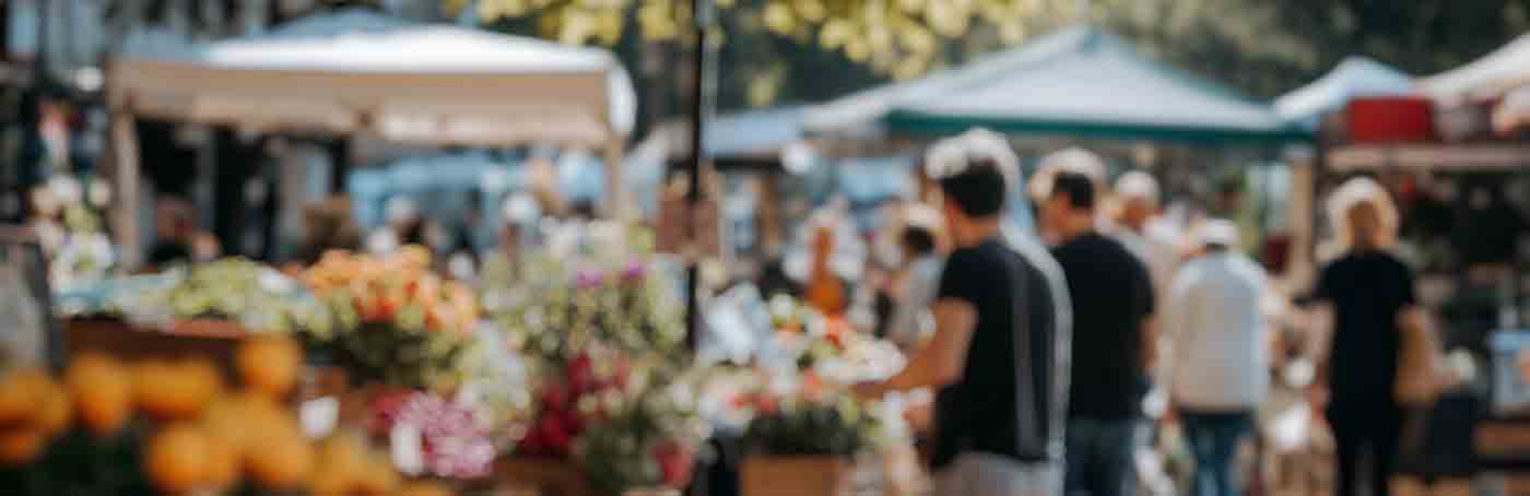 blurred out summertime outdoor farmers market